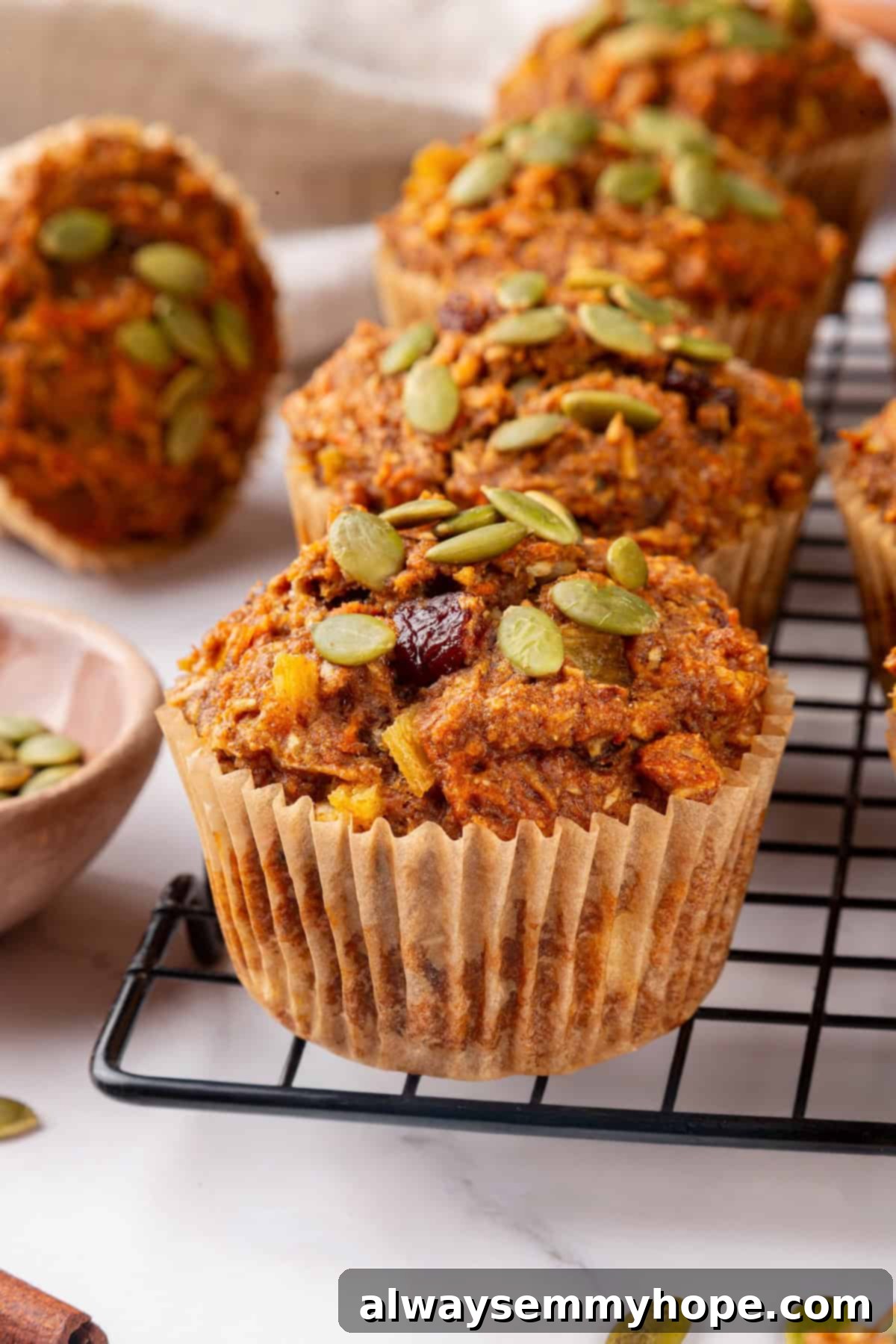 Vegan morning glory muffins on wire rack.