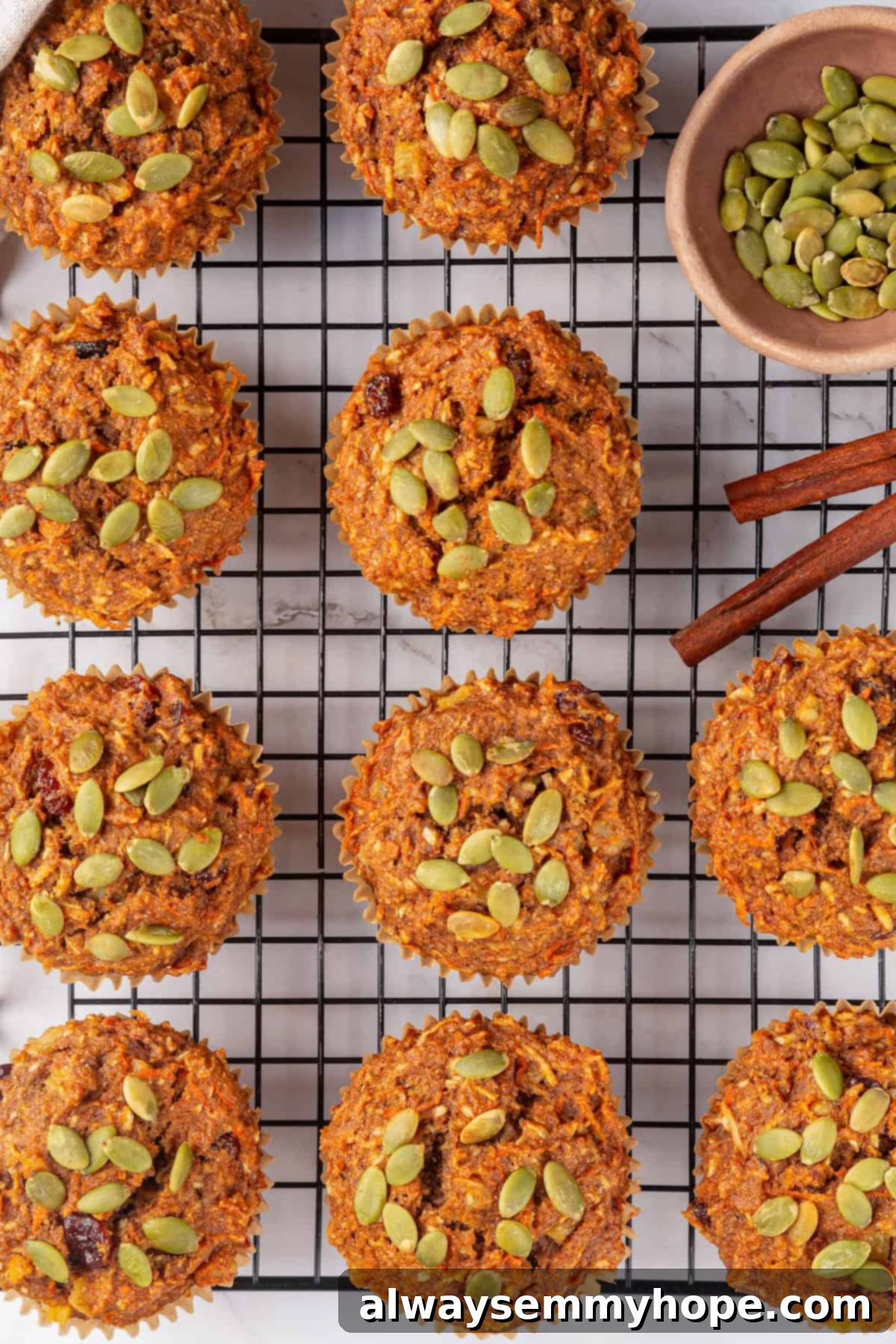 Overhead view of morning glory muffins on wire rack.