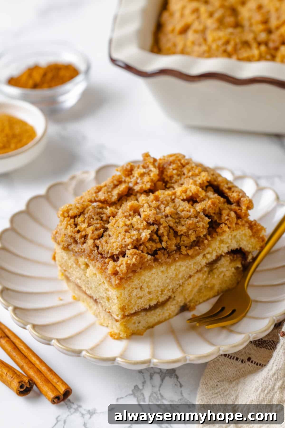Slice of vegan coffee cake on plate with fork.