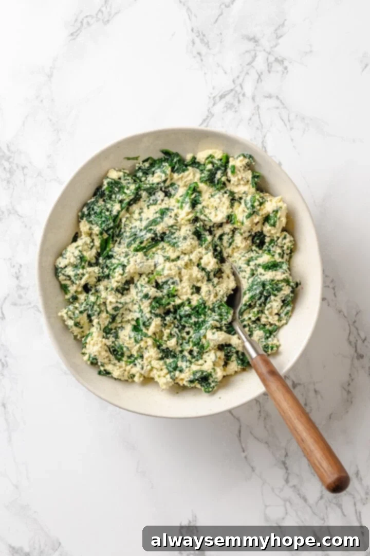 Ricotta and spinach mixture in a bowl, a delightful blend of textures and flavors that complement the butternut squash beautifully.