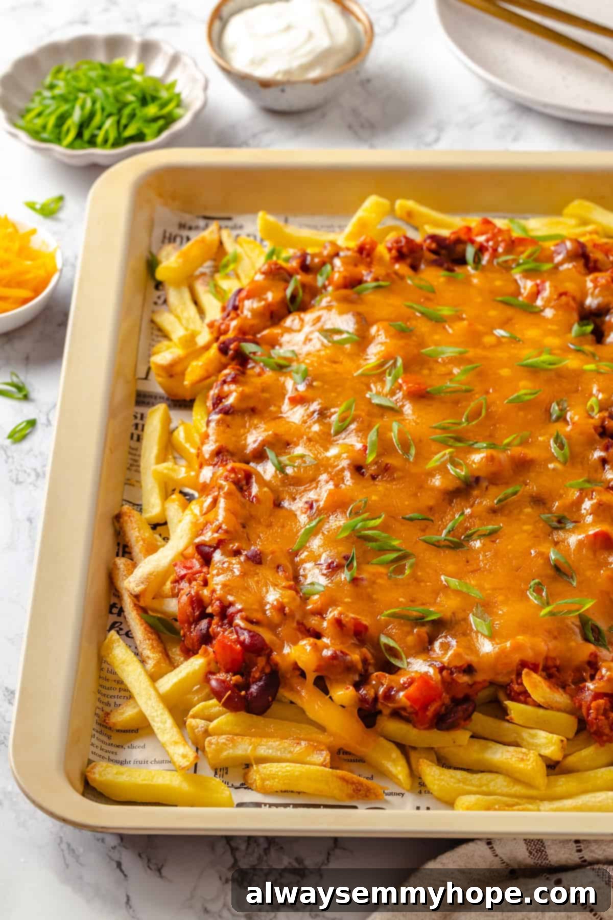 Chili cheese fries on baking tray