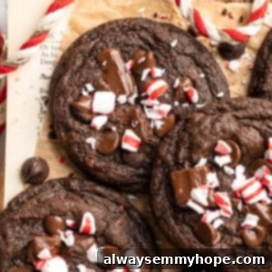 Peppermint chocolate cookies piled on parchment paper.