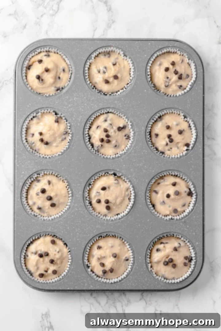 Batter in muffin pan ready for baking