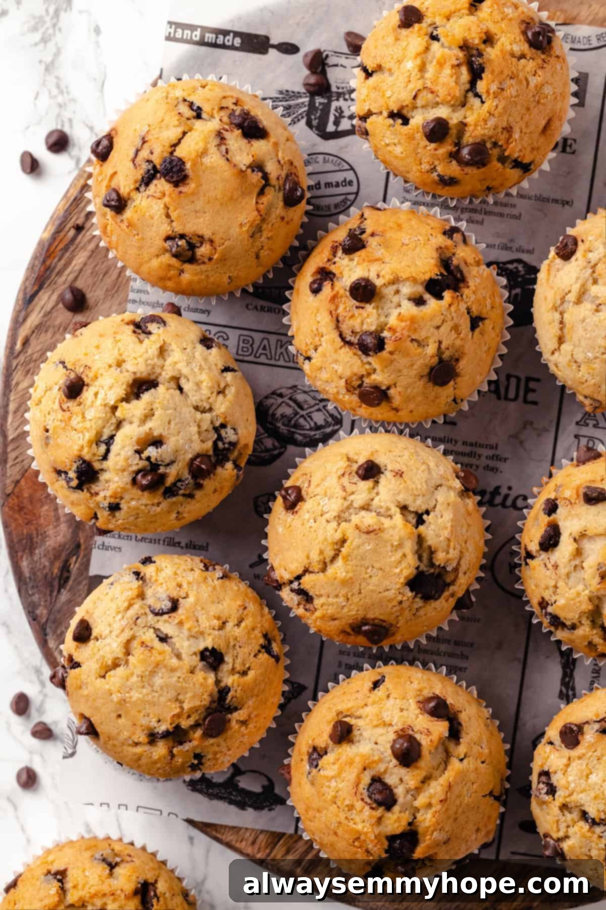 Overhead view of vegan chocolate chip muffins on a wooden board