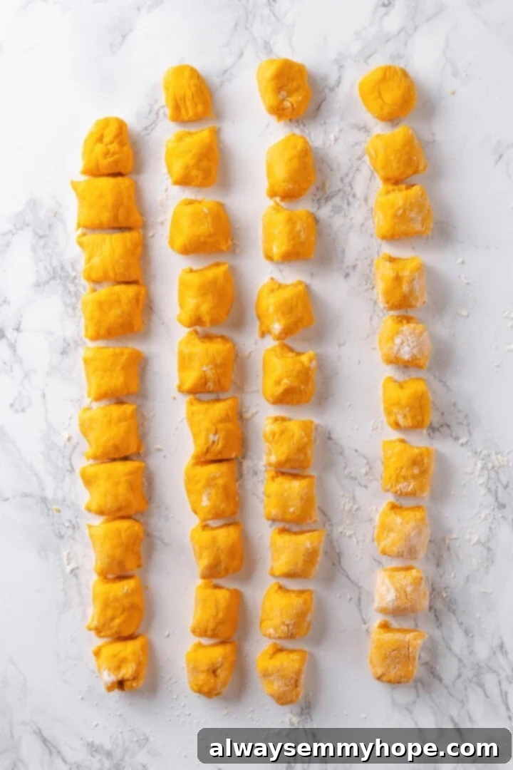 Sweet potato gnocchi dough cut into pieces.