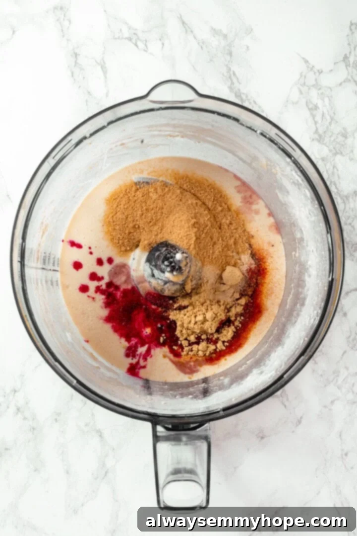 Ingredients being added to the food processor to create the red base for the vegan salami.