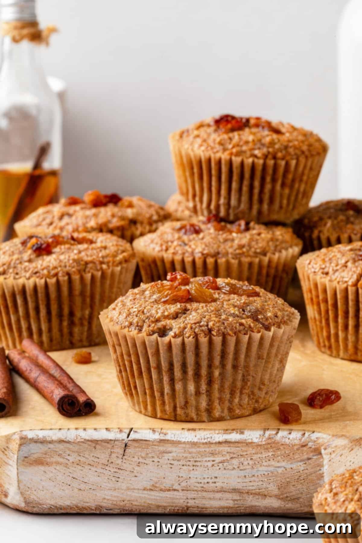 Pile of vegan bran muffins on cutting board, showcasing their delicious texture.
