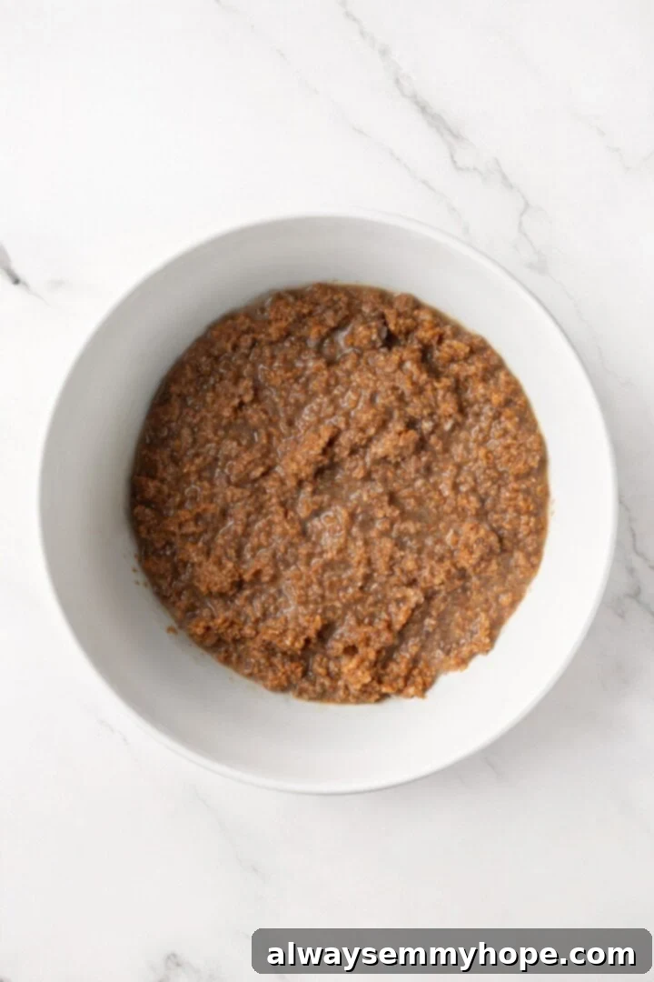 Wet ingredients for the vegan bran muffins in a bowl, ready to be combined.