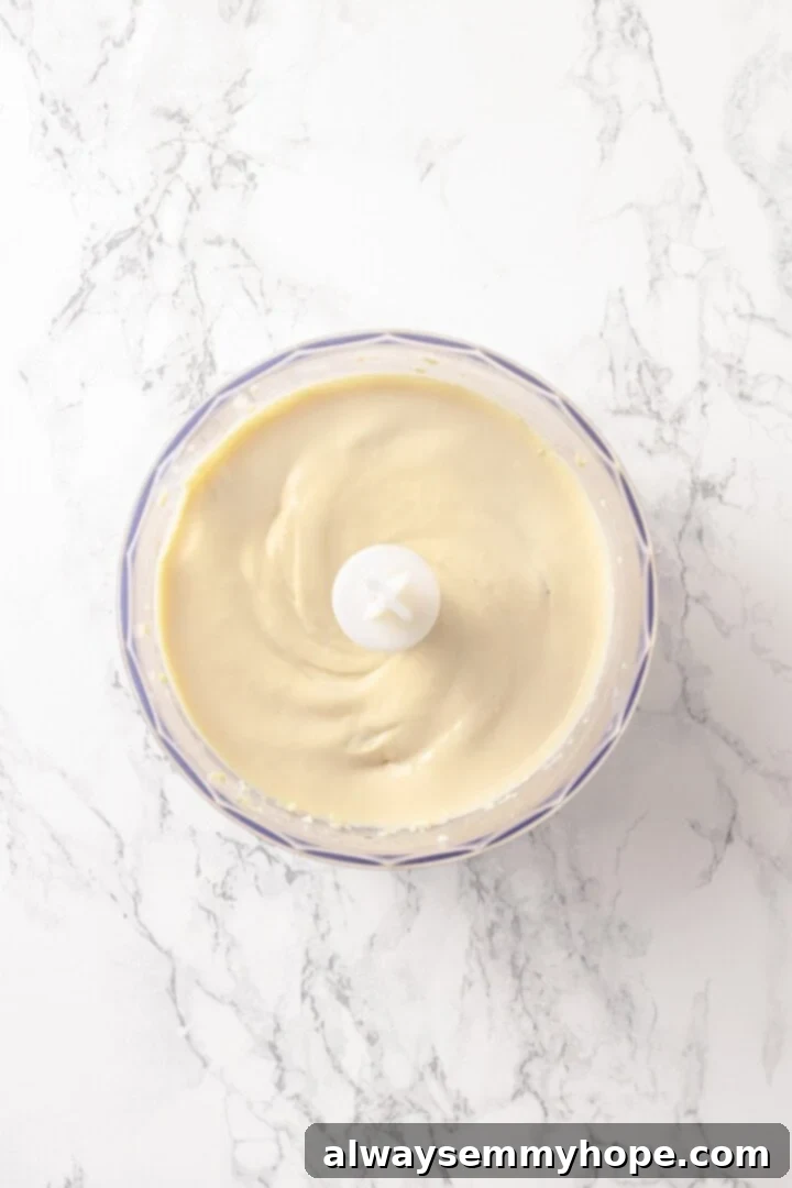 Pureed tofu in food processor bowl