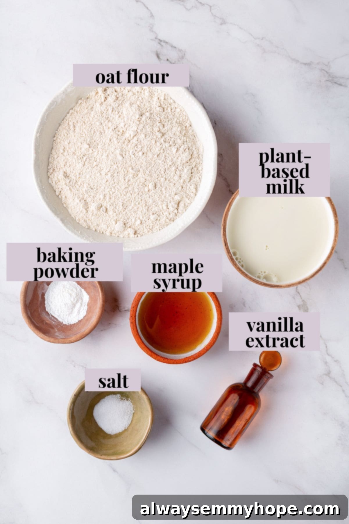 Clearly labeled ingredients for preparing oat flour pancakes.