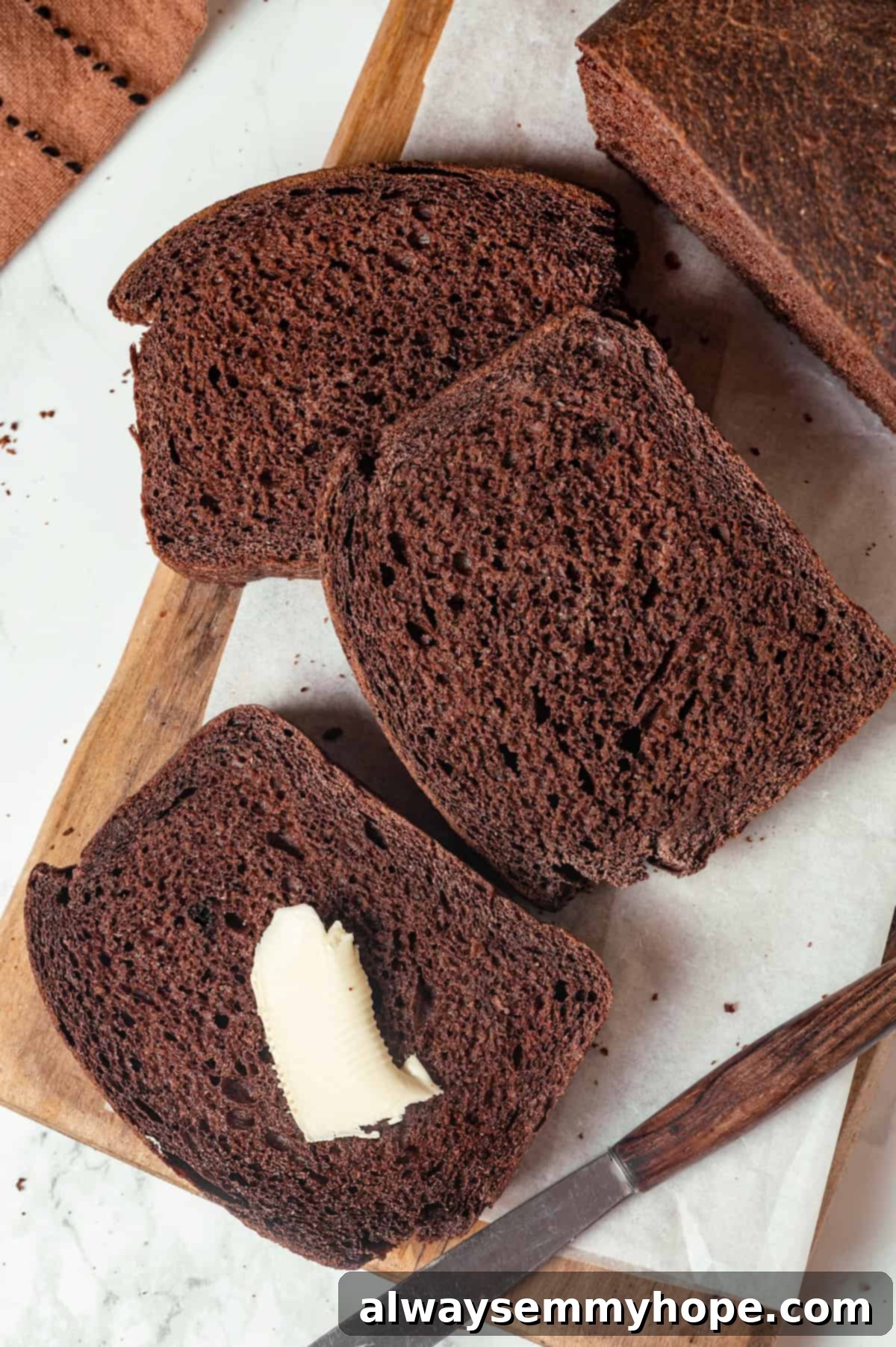 Pumpernickel Bread: A Deep Dive into Flavor and Tradition 9 Slices of pumpernickel bread, one buttered