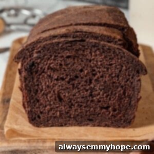 Pumpernickel Bread: A Deep Dive into Flavor and Tradition 10 Sliced loaf of pumpernickel bread.