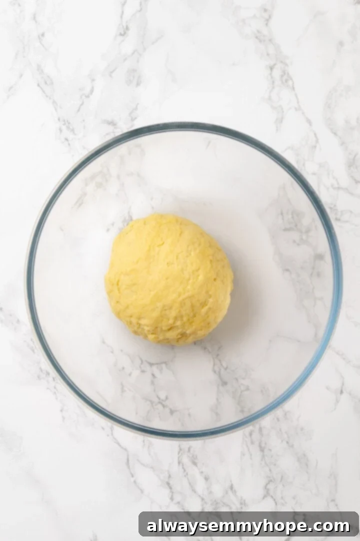 Mushroom Ravioli Delight 4 Ball of pasta dough in glass bowl.