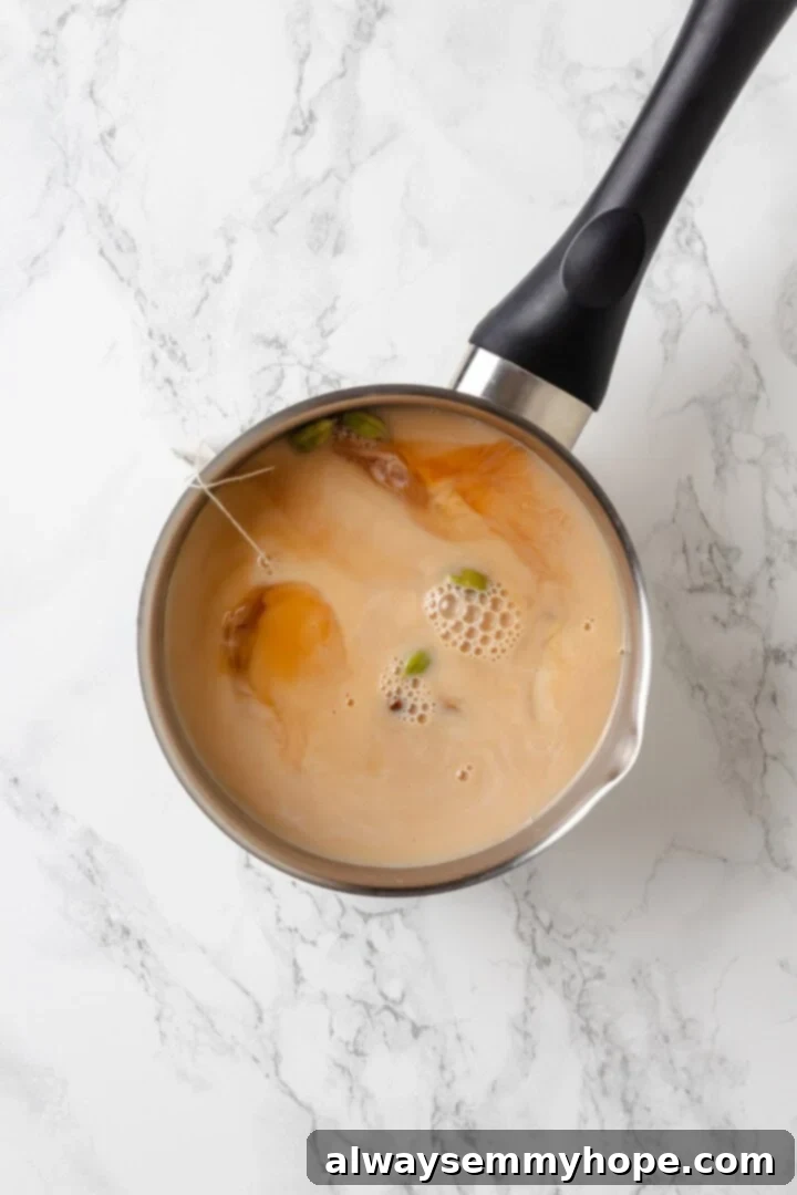 Spiced Chai Serenity 4 Ingredients for spiced chai in saucepan.