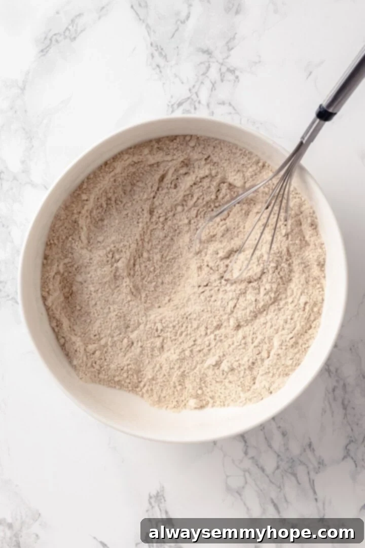 Peanut Butter Banana Bliss Muffins 5 Dry ingredients in mixing bowl with whisk