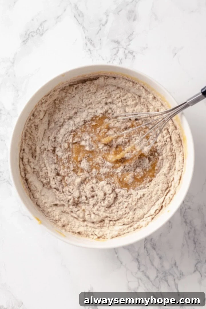 Peanut Butter Banana Bliss Muffins 6 Dry ingredients and wet ingredients being whisked in mixing bowl