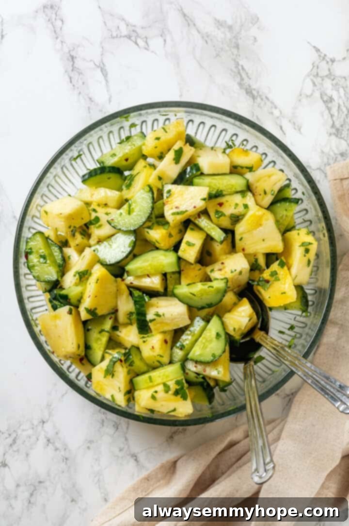 Pineapple Cucumber Refresher 6 Pineapple cucumber salad in a mixing bowl, coated in the delicious lime dressing.