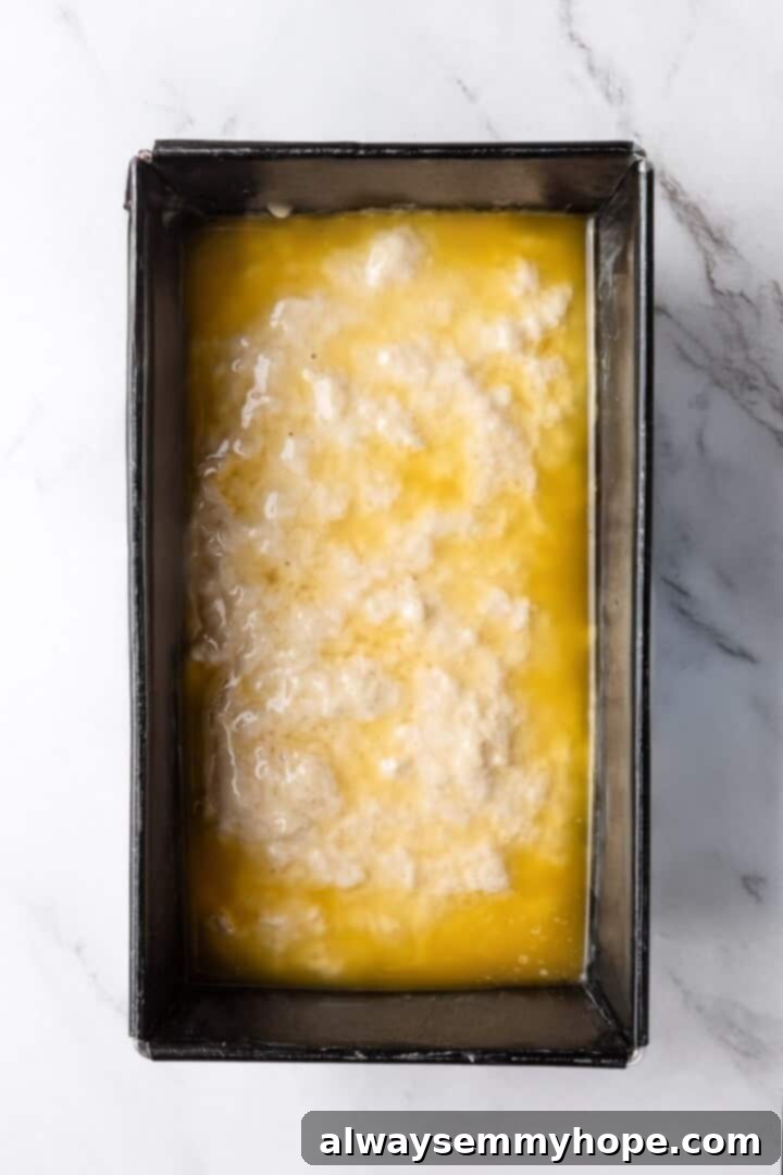 Effortless Beer Bread: A Simple 6-Ingredient Recipe 6 Beer bread batter in pan topped with butter